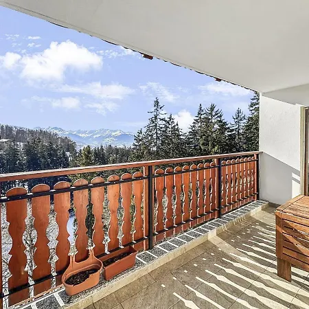 Between Slopes And Golf Facing The Alps