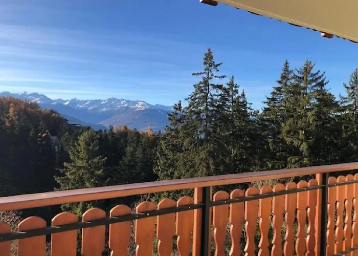 Between Slopes And Golf Facing The Alps